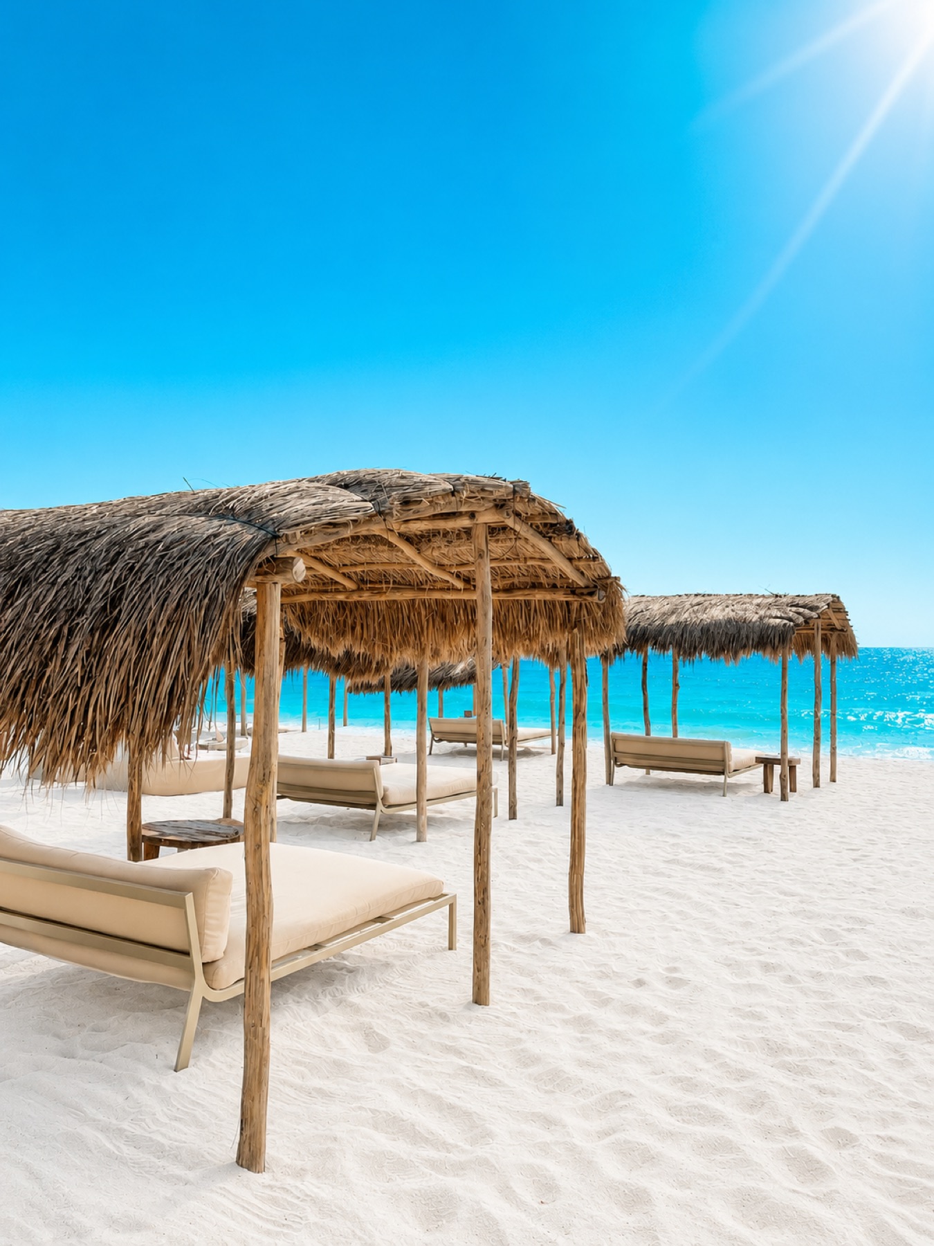 Row of beach palapas at a Tulum beach club