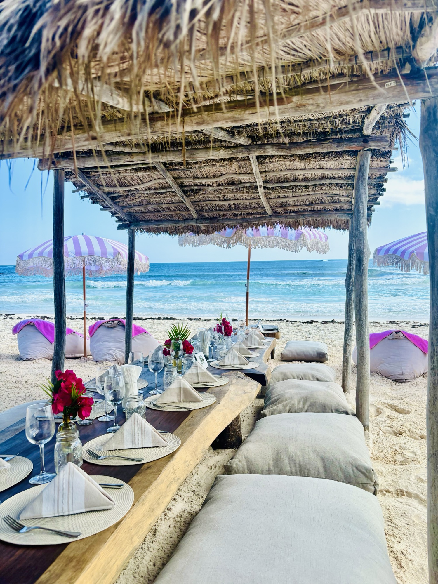 Beachfront palapa setting at Amansala in Tulum