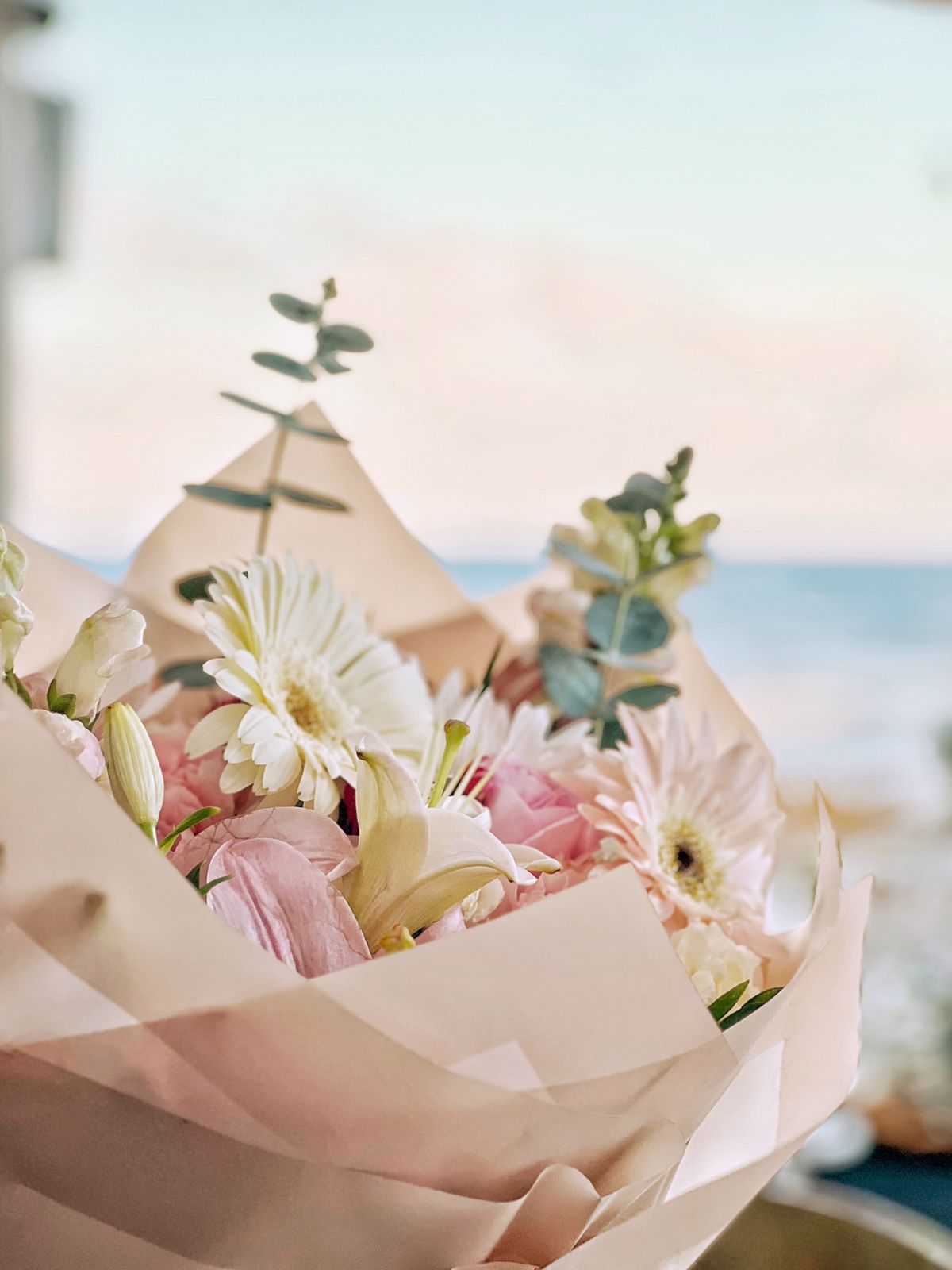 Fresh flower bouquet with the Caribbean Sea in the background