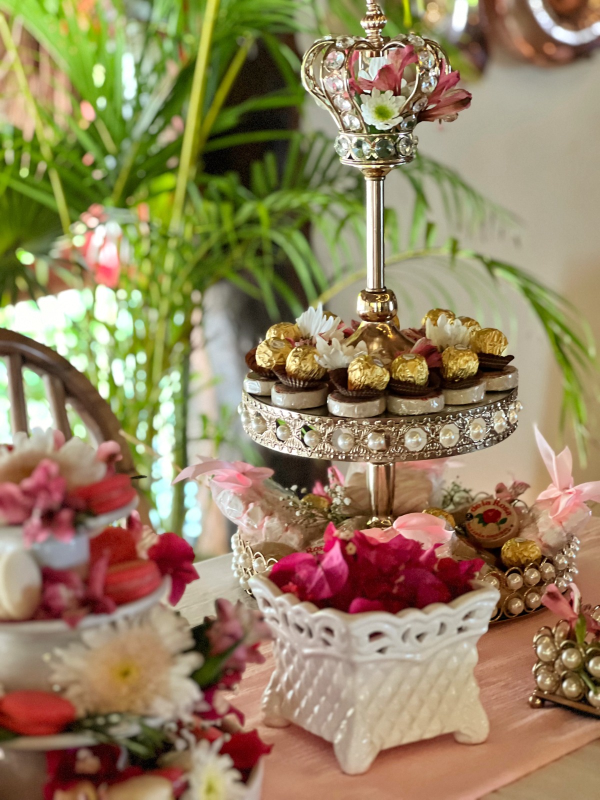 Gold crown dessert stand with chocolates at a birthday celebration