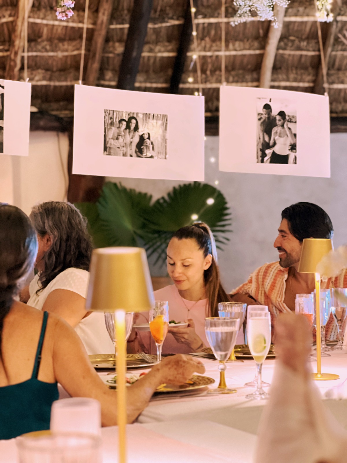 Guests enjoying birthday dinner under the palapa