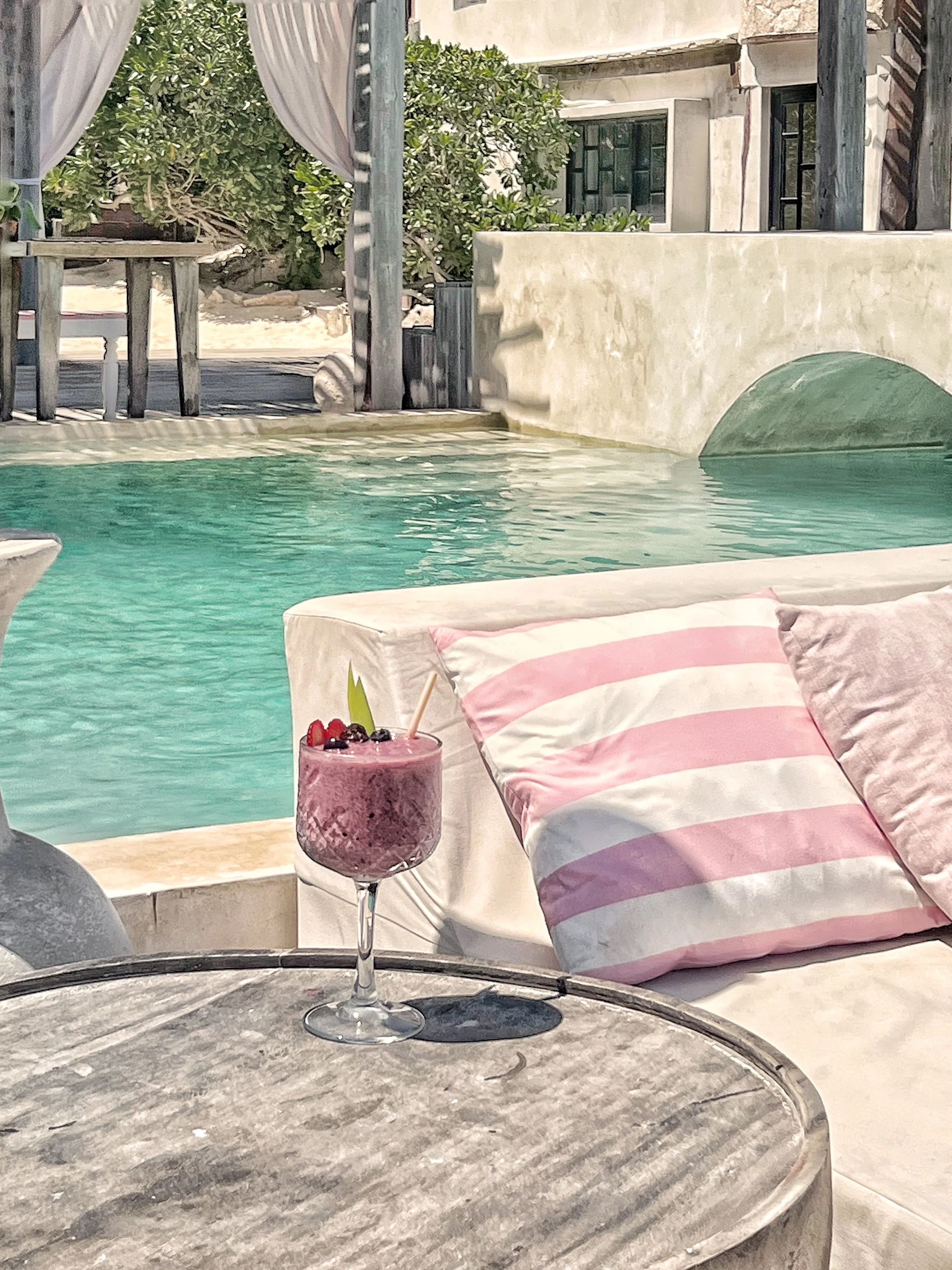 Chica Beach Club pink umbrellas pool cocktails Tulum bachelorette