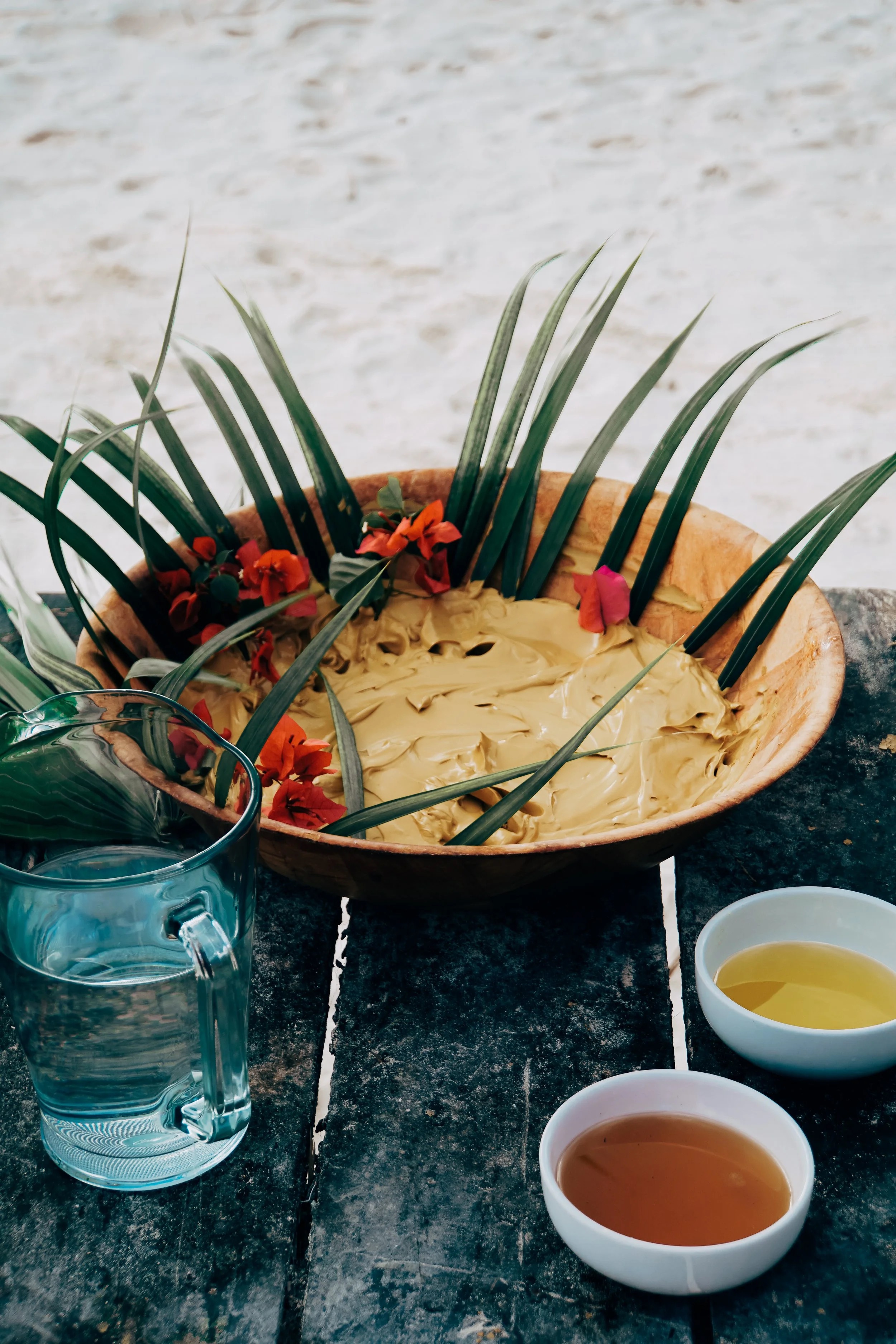 Mayan clay ritual preparation on the beach Tulum bachelorette