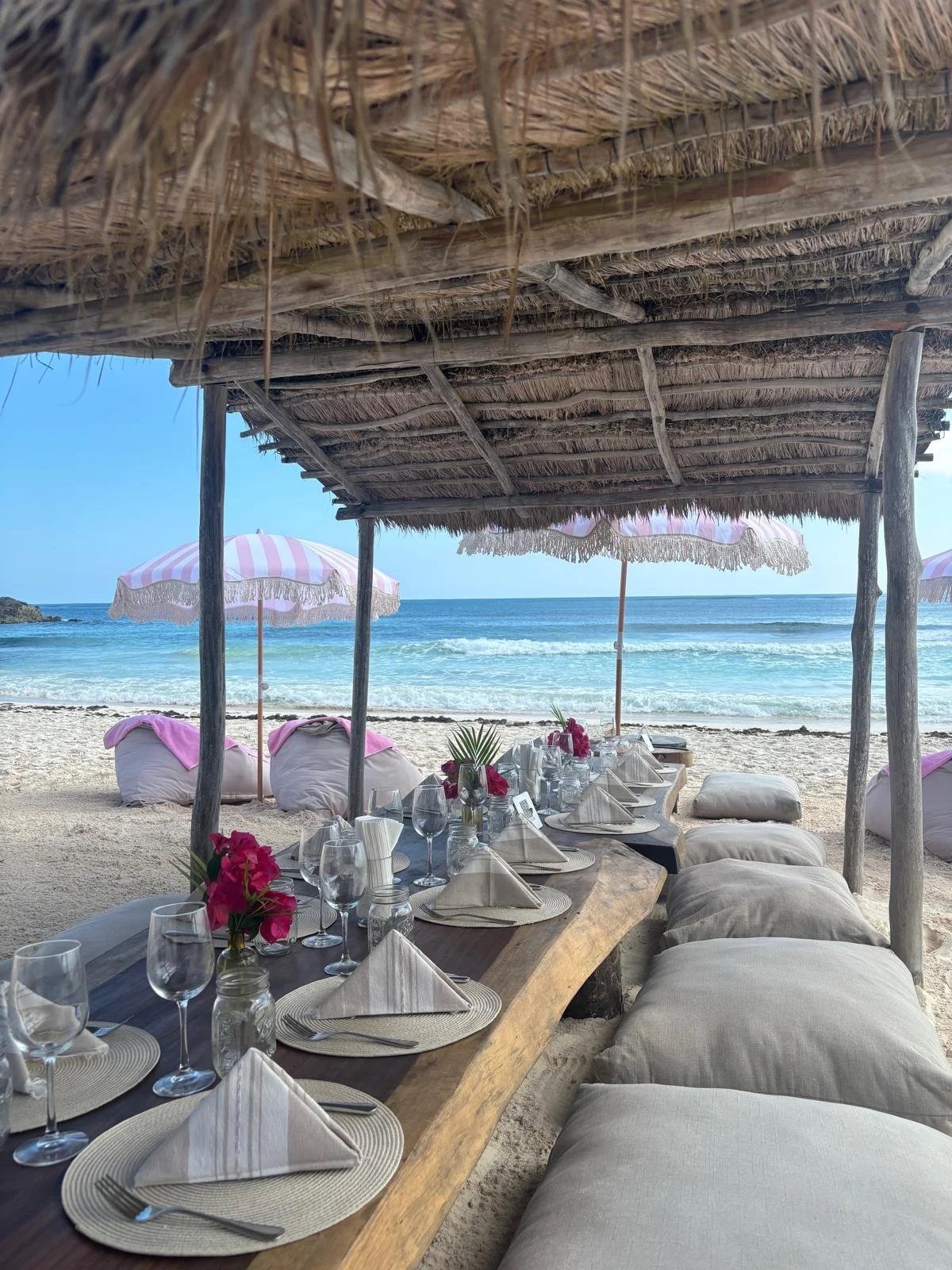 Private beachfront dinner fairy lights candles Tulum bachelorette