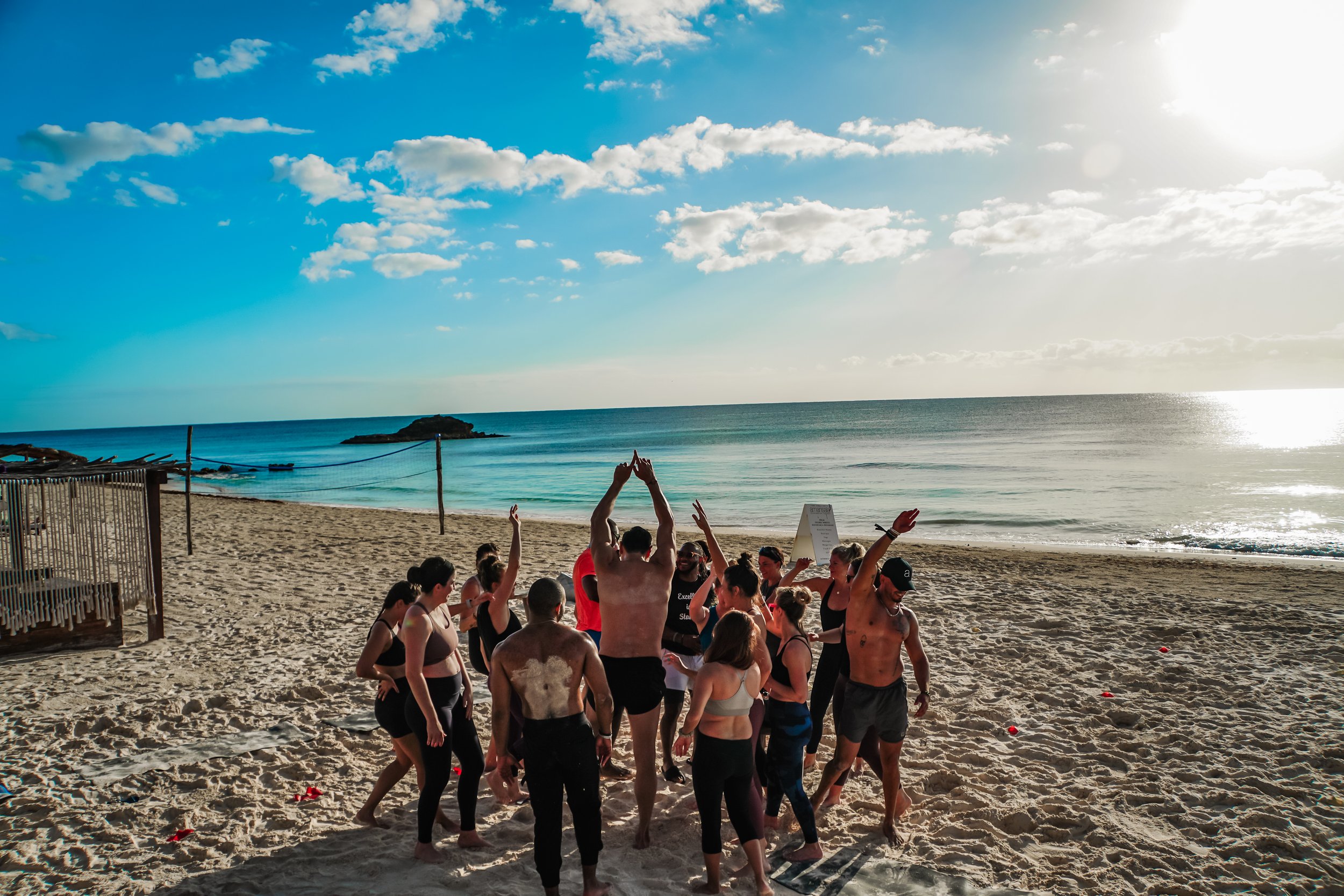A group of peoples are enjoying on the beach of tulum