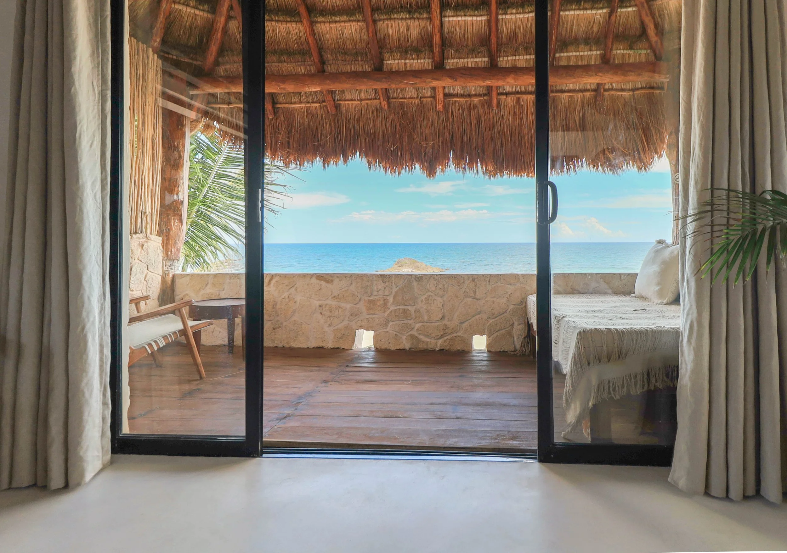 Candlelit beachside dinner setting for couples at Amansala Tulum