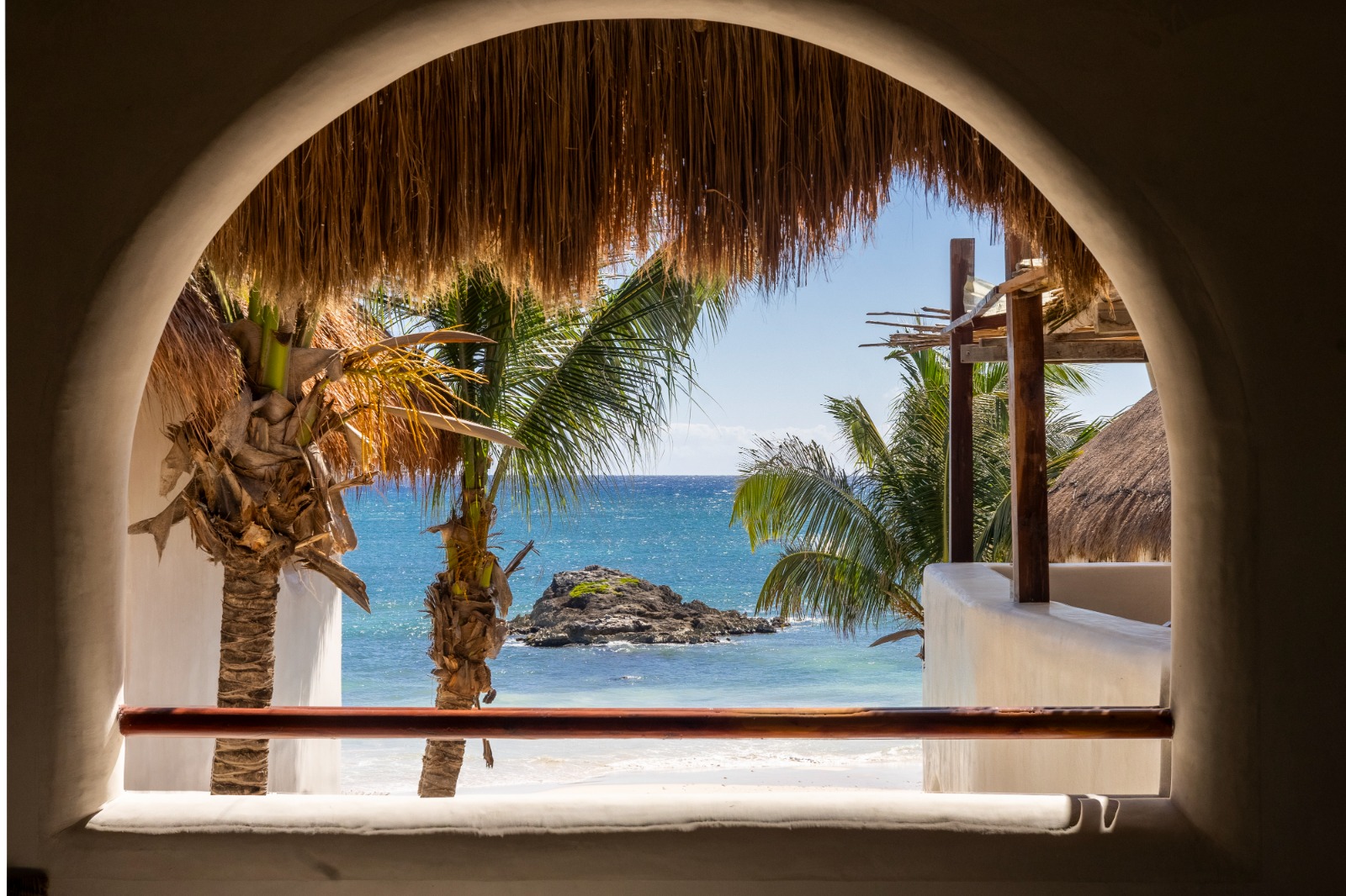 Chi Ka arched window ocean view