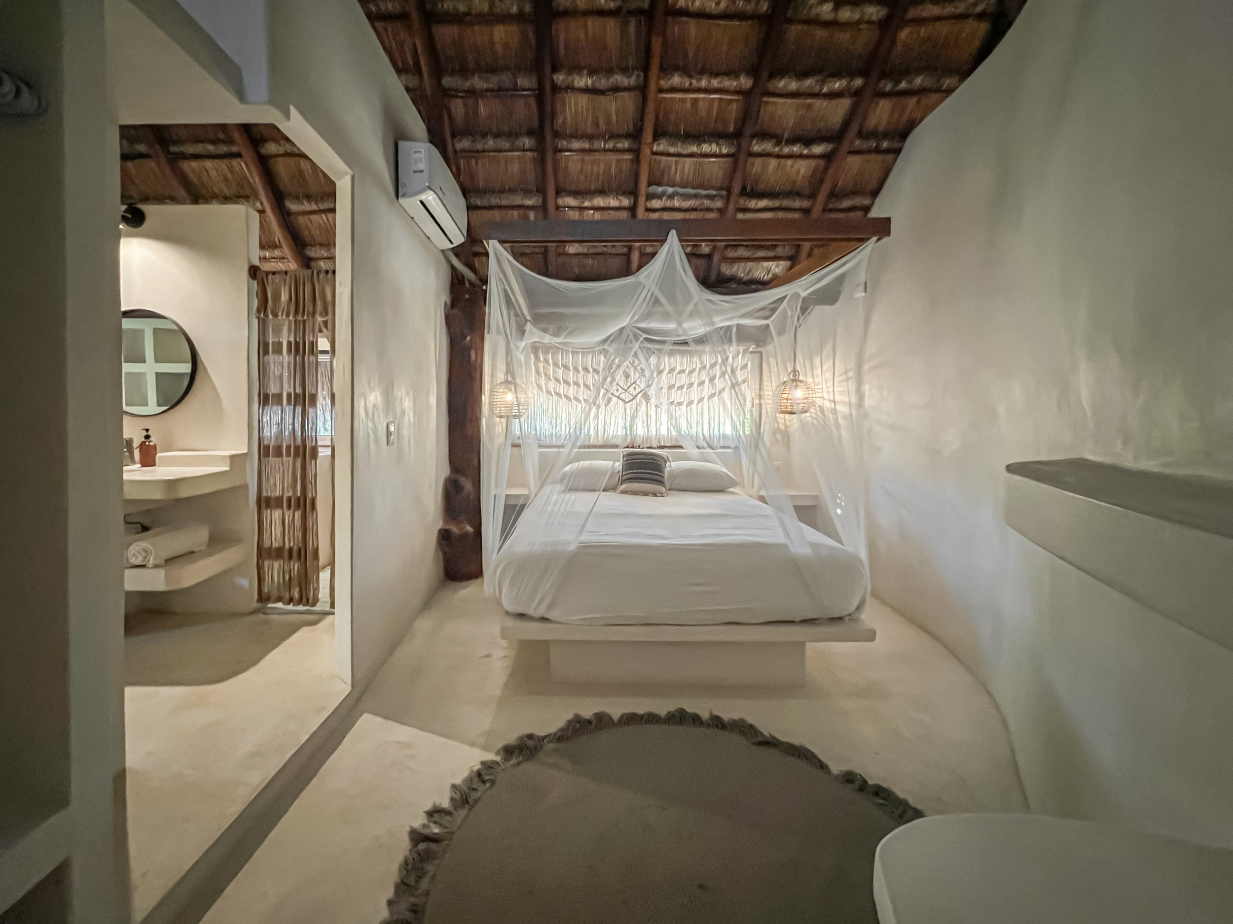 Casa Grande queen bed and bathroom