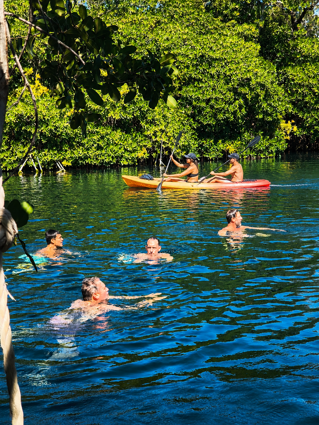 Swimming during a kayak excursion