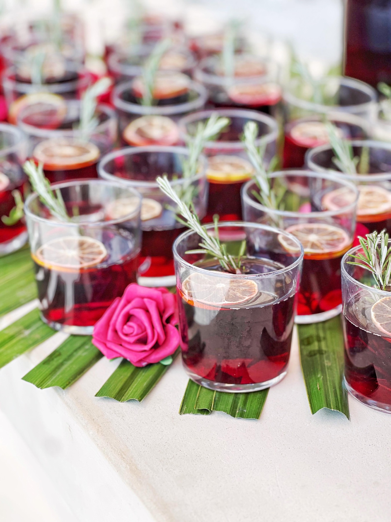 Hibiscus cocktails with rosemary garnish