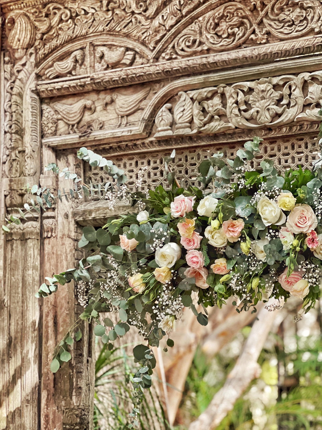 Floral arch with roses and eucalyptus