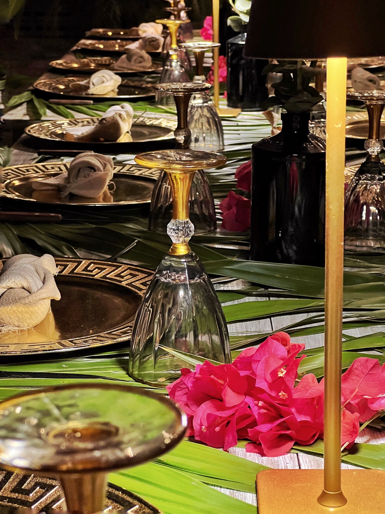 Elegant dark table setting with gold accents